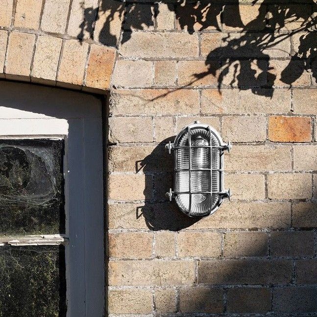 Barge wall light, cage light, glass and metal light, outside light. vintage wall light, industrial light, wholesale lighting nz, wholesale lights new zealand, bathroom lights, bathroom wall lights, outdoor lighting, industrial wall lights, nordux helford