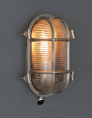 Barge wall light, cage light, glass and metal light, outside light. vintage wall light, industrial light, wholesale lighting nz, wholesale lights new zealand, bathroom lights, bathroom wall lights, outdoor lighting, industrial wall lights, nordux helford, 